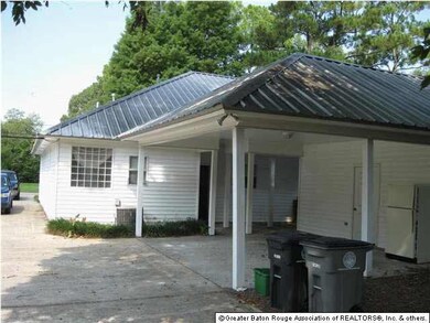Rear carport, porch and storage.