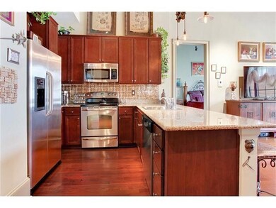 Roomy kitchen with maple cabinets, SS appliances a