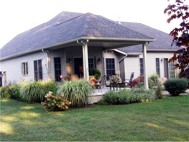 Exterior Back. Covered porch can be fully enclosed
