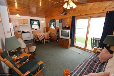 Vaulted Great room with knotty pine.