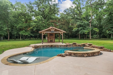 Welcoming pool, spa and beautiful trees makes for