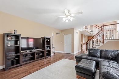 Stairway separates great room from breakfast room 