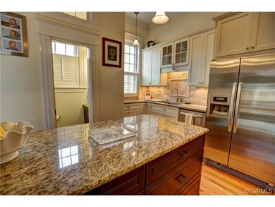 additional kitchen view and downstairs half bath