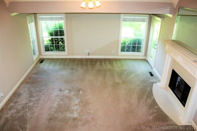 Spacious and bright living. Check out that firepla