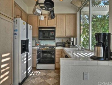 Sunny Kitchen boasts solarium windows for great vi
