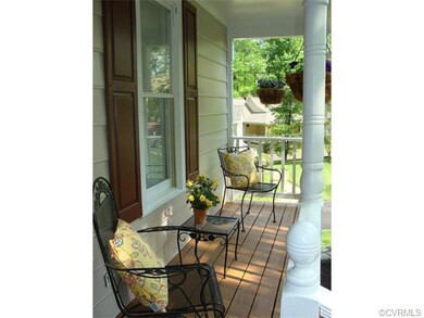 A cute covered entry welcomes family & friends.