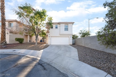 Mediterranean / spanish home featuring stucco siding, driveway, an attached garage, and a tiled roof
