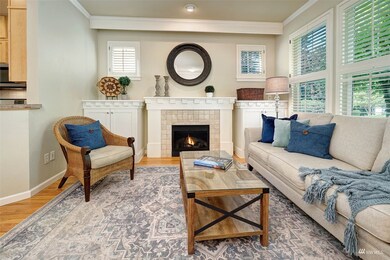 Architectural details include crown and dentil molding in this bright living room.
