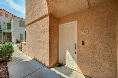 View of exterior entry featuring stucco siding