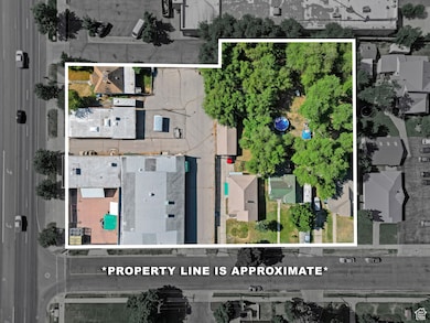 Aerial view of residential area featuring property boundaries highlighted