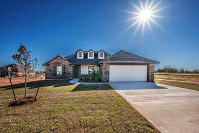 View of front facade with a garage and a front yar