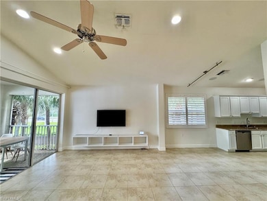 Unfurnished living room featuring a wealth of natu