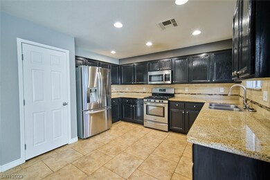 Kitchen with granite counters, ample cabinets, pan
