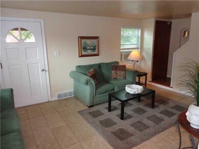 Living Room. The house is freshly painted with neutral colors.