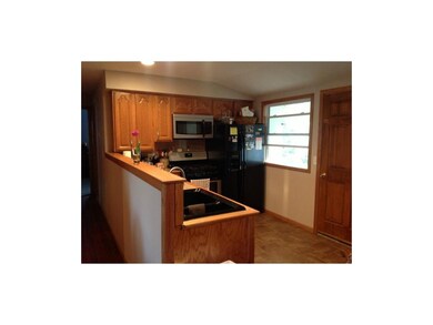 Remodeled kitchen with tile floors.