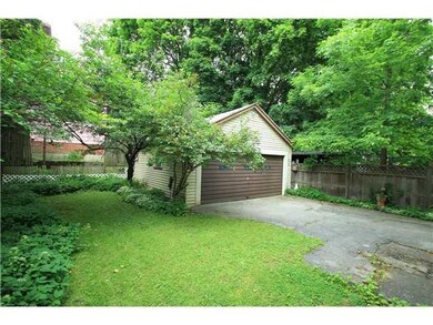 Exterior Back 2-Car garage and fenced yard (with e