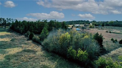 Birds eye view of property featuring a rural view