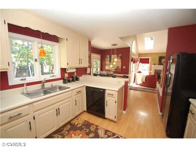 Kitchen - Bright Eat-in Kitchen opens to Family Ro