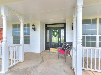 Entrance to property featuring covered porch