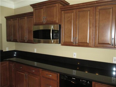 Beautiful cabinets, granite & molding . . .