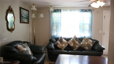 Living room featuring ceiling fan
