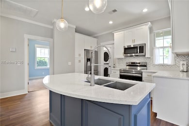 Center island, custom cabinets, upgraded lighting,