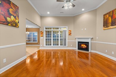 Unfurnished living room featuring ceiling fan with
