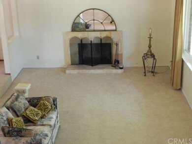 Living room looking down from stairs.