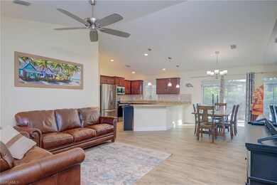 Living room featuring sink, ceiling fan with notab
