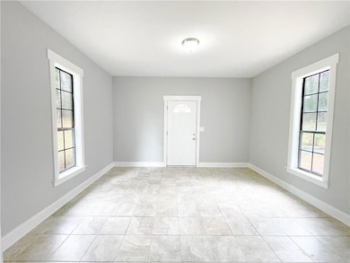 Empty room featuring healthy amount of natural light