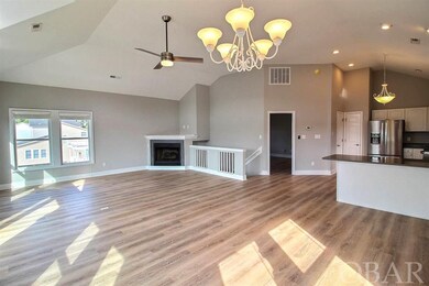 Grand Room with Gas Fireplace and Top Deck Access.