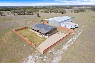 Birds eye view of property featuring a rural view