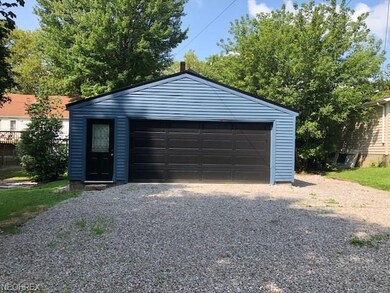 Large parking area and two and half car garage wit
