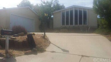 Front of Home with drive through driveway