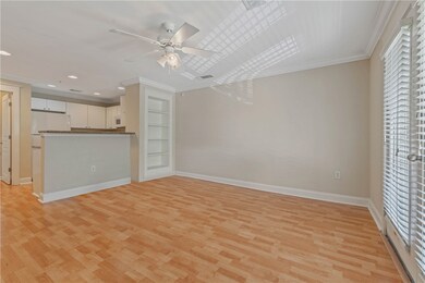 Unfurnished living room with visible vents, crown