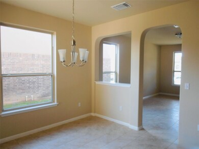 Unfurnished dining area with arched walkways, lig