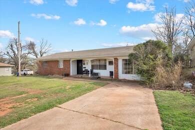 Ranch-style house featuring a front lawn and brick