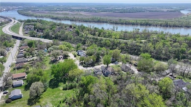 Drone / aerial view featuring a water view and a residential view
