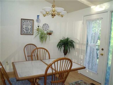 Kitchen. Eating area of kitchen w/laminate floor a