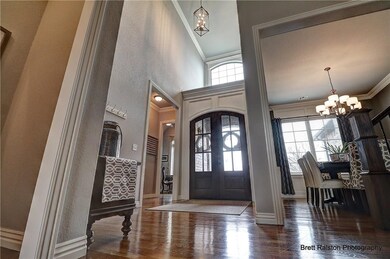 Soaring ceilings, crown molding, wood floors & lot