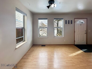 Foyer with light hardwood / wood-style flooring an