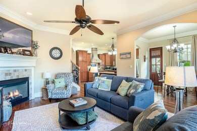 Living room with dark wood-type flooring, ceiling 
