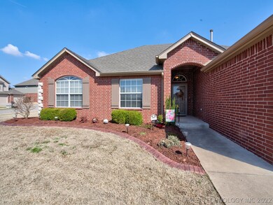 Brick Arched Opening to Covered Front Porch, Glass