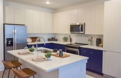 Kitchen featuring appliances with stainless steel 