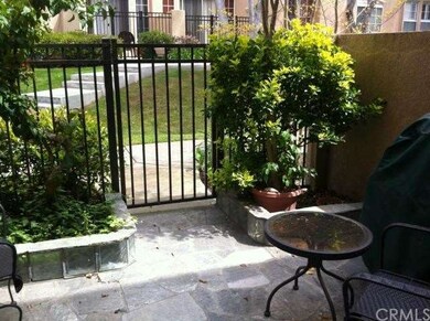 Gated stone patio is a perfect place to relax afte