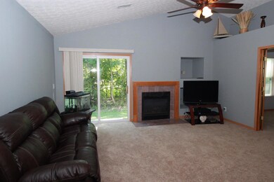 Great Room w/ Vaulted Ceilings & Fan.