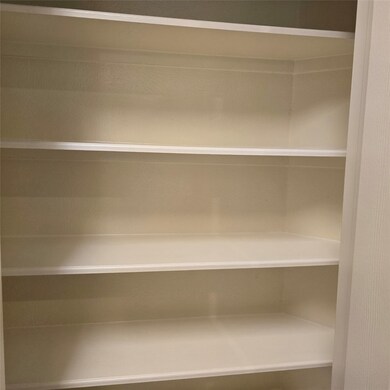 Freshly painted pantry with elegant built-in white