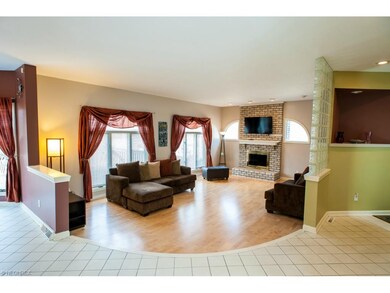 Contemporary living space with stone fireplace.
