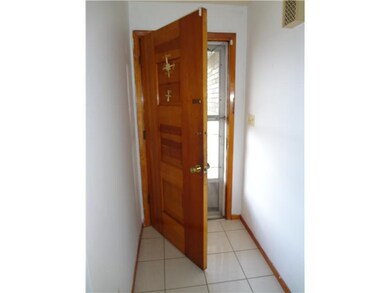 Entry/Foyer. Stylish Wooden Door opens to the Tile