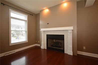 GAS Fireplace w/white surround.  Plenty room to ha